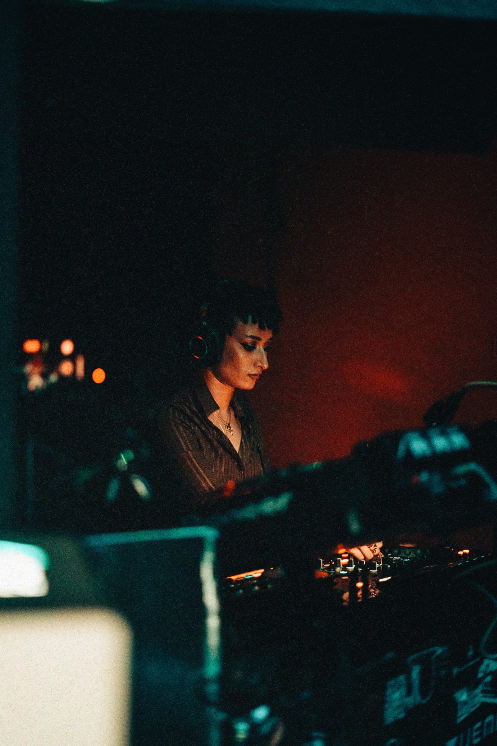 SUNDRUH at the decks in low-light club